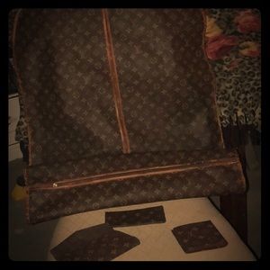 Louie Vuitton Vintage Garment bag, wallet Nd More.